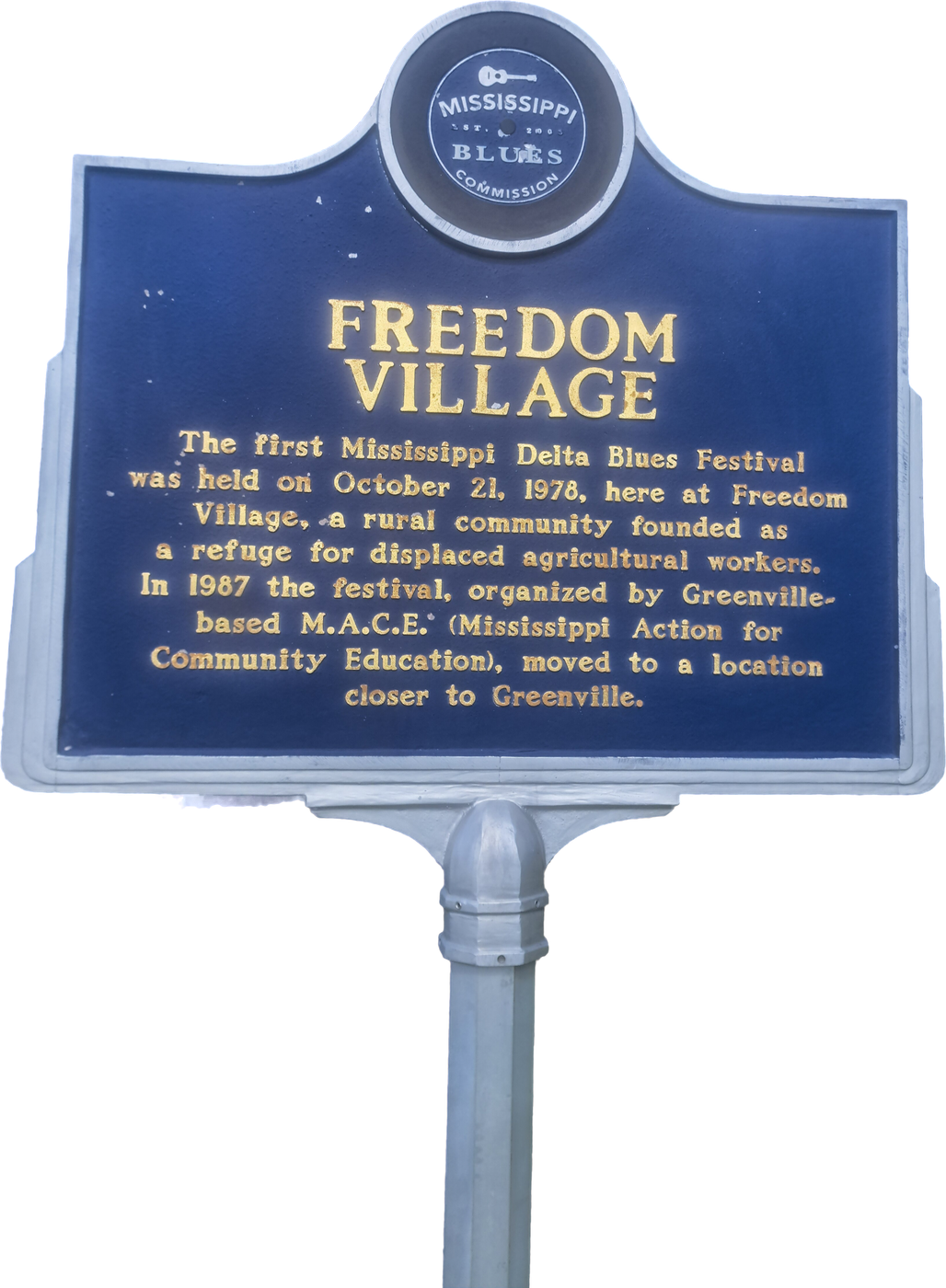 Mississippi Blues Trail marker for Freedom Village on its post